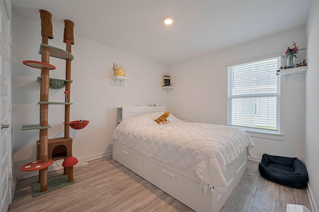 3918 Beltingham Bend Way, Fulshear, TX 77441 - bedroom featuring multiple windows and light wood finished floors
