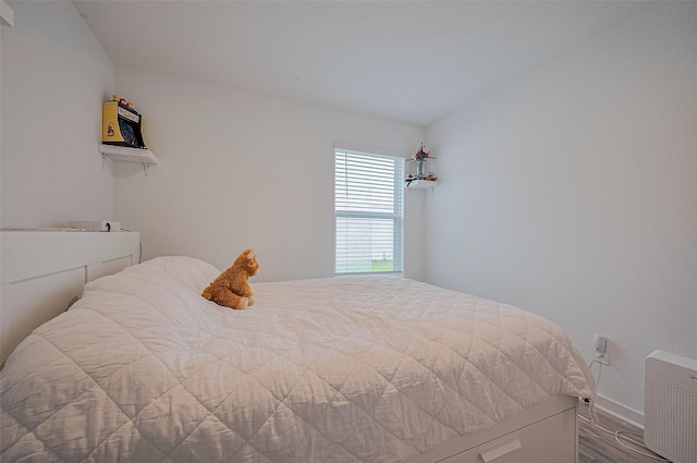 3918 Beltingham Bend Way, Fulshear, TX 77441 - bedroom with wood finished floors and baseboards