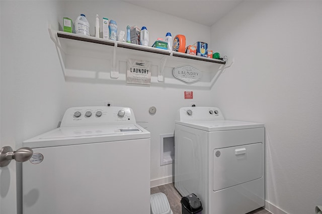 3918 Beltingham Bend Way, Fulshear, TX 77441 - laundry area with washer and clothes dryer and wood finished floors