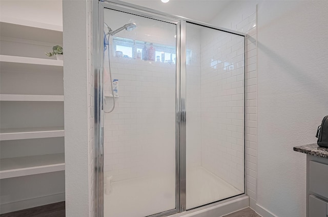 3918 Beltingham Bend Way, Fulshear, TX 77441 - bathroom featuring a stall shower, vanity, and wood finished floors