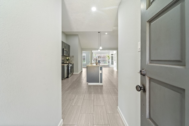 16310 Mulberry Run Ct, Sugar Land, TX 77498 - hall featuring baseboards and lofted ceiling