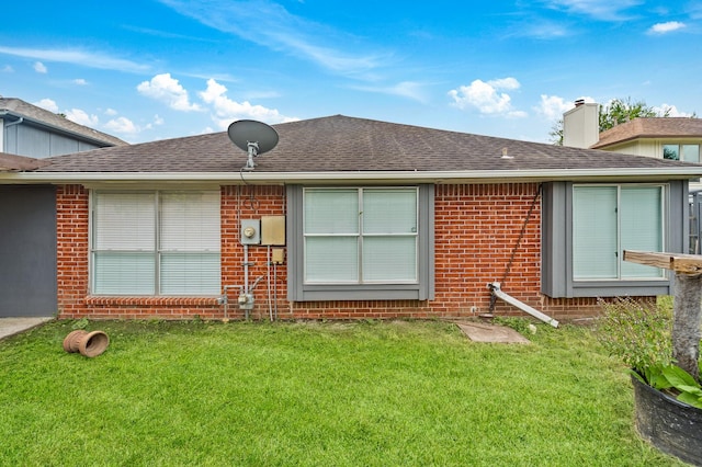 16310 Mulberry Run Ct, Sugar Land, TX 77498 - back of house featuring brick siding, a lawn, a chimney, and roof with shingles