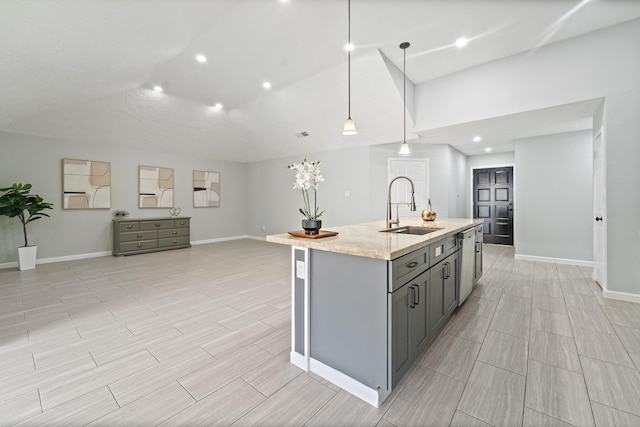 16310 Mulberry Run Ct, Sugar Land, TX 77498 - kitchen with gray cabinetry, a kitchen island with sink, hanging light fixtures, light stone counters, and recessed lighting