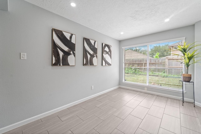16310 Mulberry Run Ct, Sugar Land, TX 77498 - empty room featuring a textured ceiling and recessed lighting