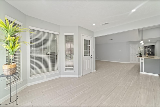 16310 Mulberry Run Ct, Sugar Land, TX 77498 - unfurnished living room with light wood-style floors and recessed lighting
