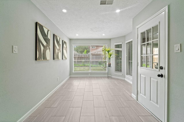 16310 Mulberry Run Ct, Sugar Land, TX 77498 - spare room featuring a textured ceiling and recessed lighting