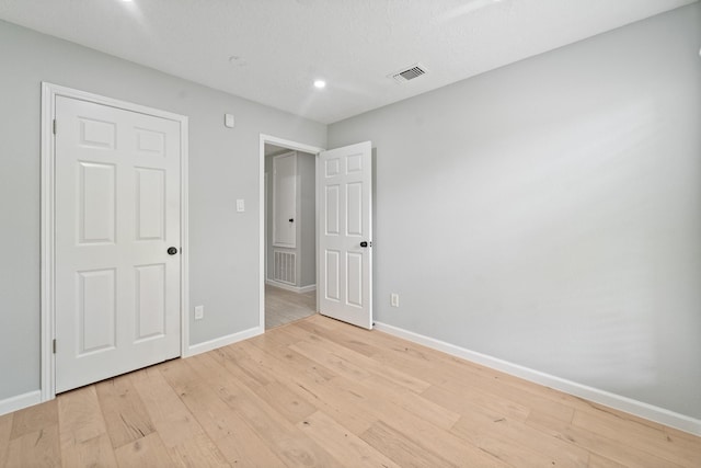 16310 Mulberry Run Ct, Sugar Land, TX 77498 - unfurnished bedroom featuring light wood-style flooring and recessed lighting