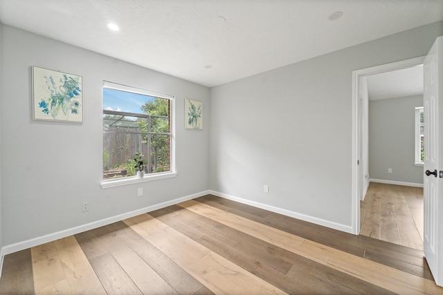 16310 Mulberry Run Ct, Sugar Land, TX 77498 - spare room with hardwood / wood-style flooring and recessed lighting
