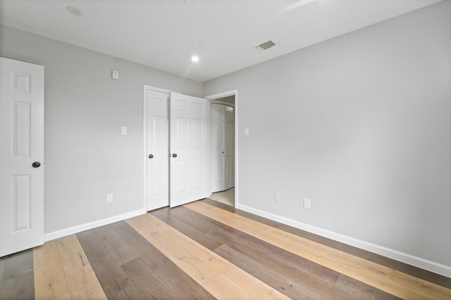 16310 Mulberry Run Ct, Sugar Land, TX 77498 - unfurnished bedroom featuring hardwood / wood-style floors and recessed lighting