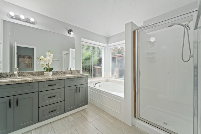 16310 Mulberry Run Ct, Sugar Land, TX 77498 - bathroom with a bath, a shower stall, double vanity, and a textured ceiling