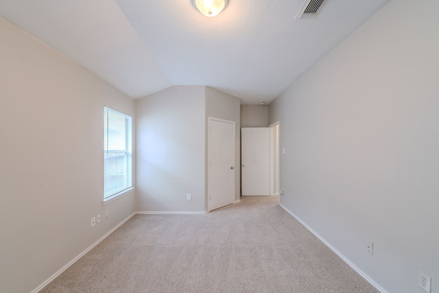 20027 Oland Way, Houston, TX 77073 - unfurnished bedroom featuring light colored carpet and lofted ceiling
