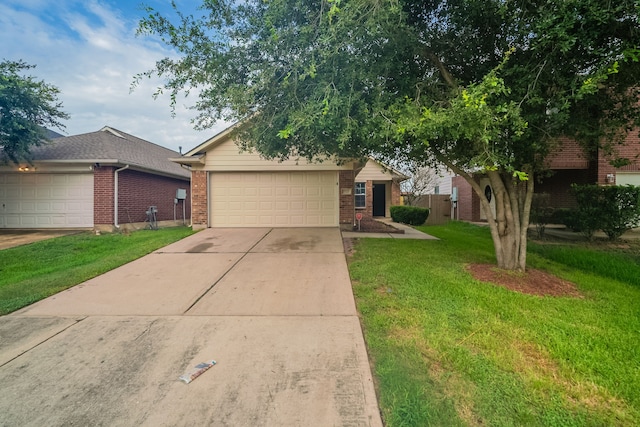 20027 Oland Way, Houston, TX 77073 - view of front of house with brick siding, a front yard, a garage, and concrete driveway