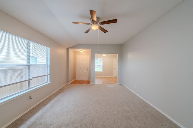 20027 Oland Way, Houston, TX 77073 - empty room with a ceiling fan, light carpet, and vaulted ceiling