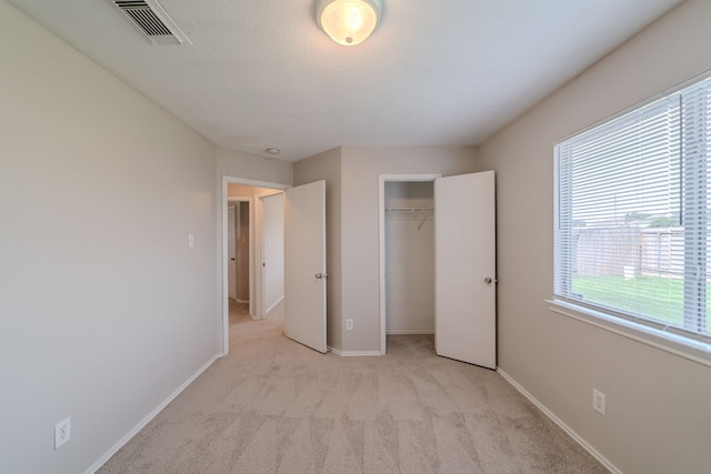20027 Oland Way, Houston, TX 77073 - unfurnished bedroom featuring light carpet and a closet