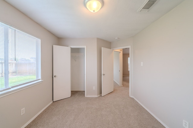 20027 Oland Way, Houston, TX 77073 - unfurnished bedroom featuring light carpet and a closet