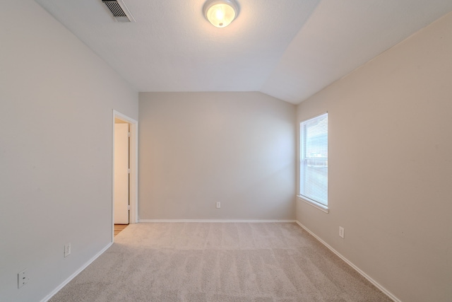 20027 Oland Way, Houston, TX 77073 - spare room featuring light carpet and vaulted ceiling