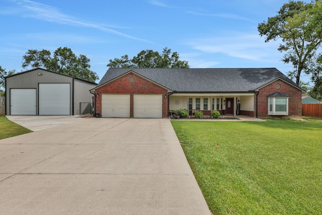 6202 Oleander Dr, Baytown, TX 77523 - view of front of home with brick siding, a shingled roof, and a detached garage
