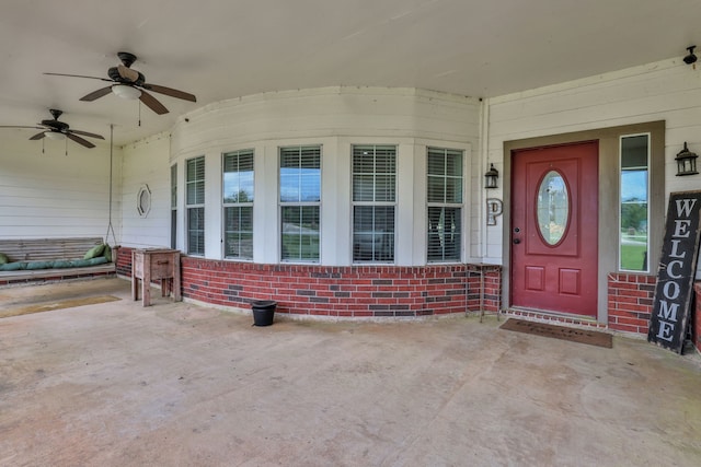 6202 Oleander Dr, Baytown, TX 77523 - view of exterior entry with brick siding and a ceiling fan
