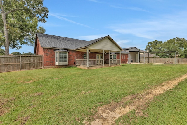 6202 Oleander Dr, Baytown, TX 77523 - rear view of house featuring brick siding, a fenced backyard, a ceiling fan, and roof with shingles