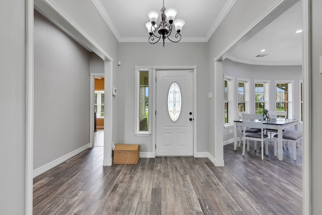 6202 Oleander Dr, Baytown, TX 77523 - foyer entrance with plenty of natural light, a chandelier, wood finished floors, crown molding, and recessed lighting