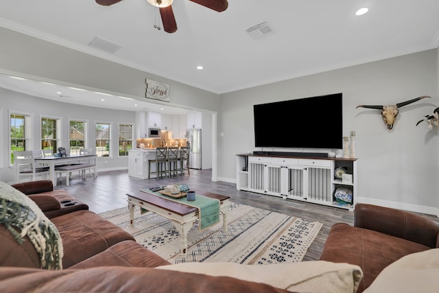 6202 Oleander Dr, Baytown, TX 77523 - living room featuring recessed lighting, crown molding, wood finished floors, and ceiling fan