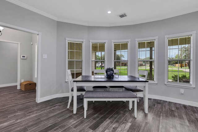 6202 Oleander Dr, Baytown, TX 77523 - dining area featuring dark wood finished floors and ornamental molding