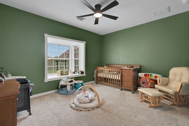 6202 Oleander Dr, Baytown, TX 77523 - carpeted bedroom featuring ceiling fan and a crib