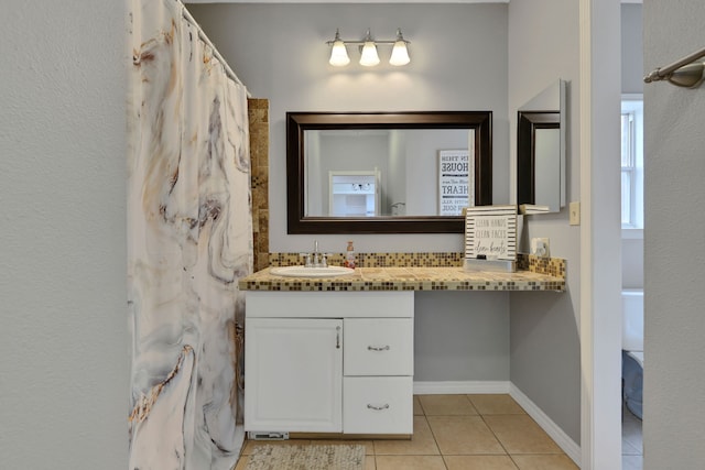 6202 Oleander Dr, Baytown, TX 77523 - full bathroom featuring tile patterned flooring, vanity, and a shower with shower curtain