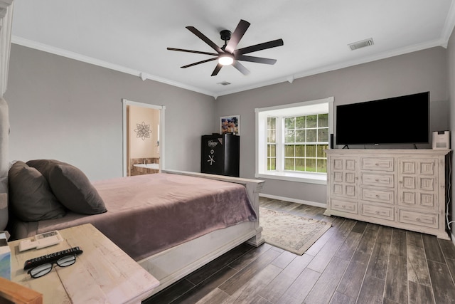 6202 Oleander Dr, Baytown, TX 77523 - bedroom with dark wood finished floors, ornamental molding, ensuite bathroom, and a ceiling fan