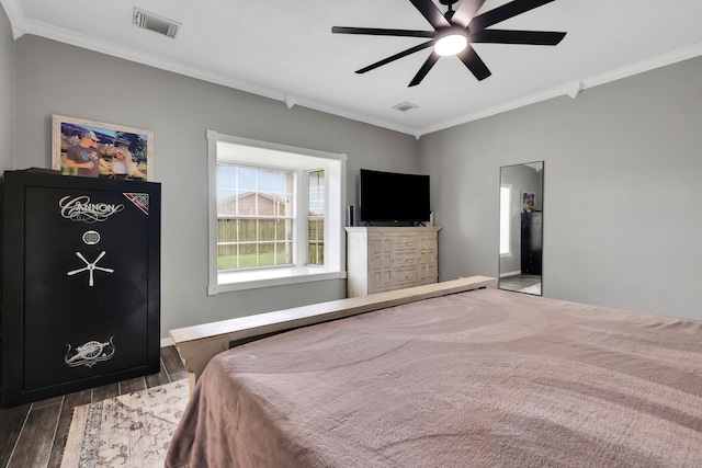 6202 Oleander Dr, Baytown, TX 77523 - bedroom featuring crown molding, wood finished floors, and a ceiling fan