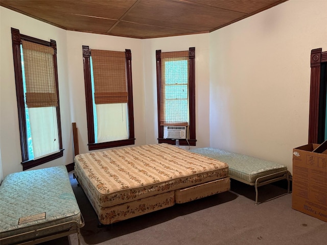 906 E Houston Ave, Crockett, TX 75835 - carpeted bedroom with wooden ceiling and cooling unit