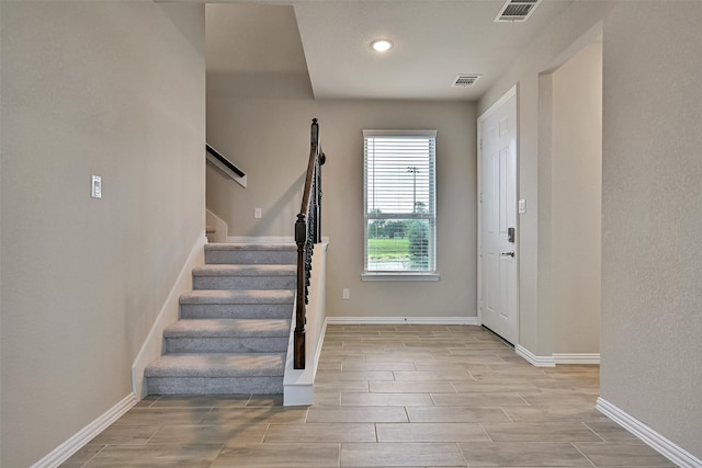160 Majestic Shores Ln, La Porte, TX 77571 - foyer featuring wood tiled floors, stairs, and recessed lighting