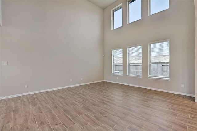 160 Majestic Shores Ln, La Porte, TX 77571 - unfurnished room featuring light wood finished floors and a high ceiling
