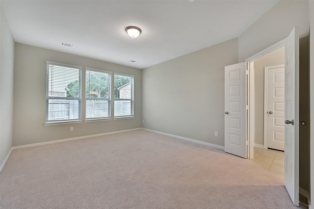 160 Majestic Shores Ln, La Porte, TX 77571 - empty room featuring light carpet and baseboards