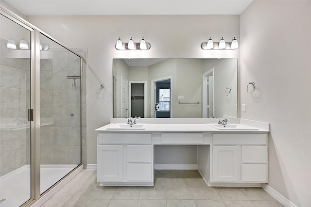 160 Majestic Shores Ln, La Porte, TX 77571 - full bathroom featuring a stall shower, double vanity, tile patterned floors, and a walk in closet