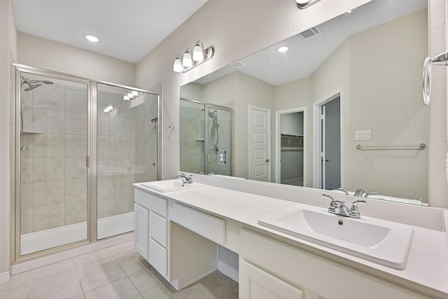 160 Majestic Shores Ln, La Porte, TX 77571 - bathroom with a stall shower, a spacious closet, tile patterned flooring, and double vanity