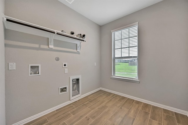 160 Majestic Shores Ln, La Porte, TX 77571 - washroom featuring electric dryer hookup, healthy amount of natural light, and wood finished floors