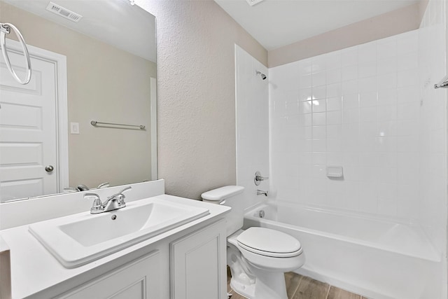160 Majestic Shores Ln, La Porte, TX 77571 - bathroom with vanity, wood finished floors, a textured wall, and bathing tub / shower combination