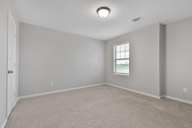 160 Majestic Shores Ln, La Porte, TX 77571 - spare room featuring light colored carpet and a textured ceiling