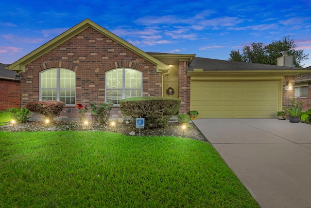 1126 Heathfield Dr, Channelview, TX 77530 - ranch-style house with brick siding, a garage, a lawn, concrete driveway, and a chimney