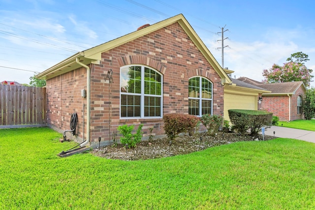 1126 Heathfield Dr, Channelview, TX 77530 - view of side of home featuring a garage, brick siding, and driveway