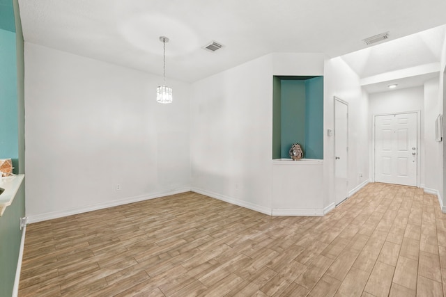 1126 Heathfield Dr, Channelview, TX 77530 - empty room featuring light wood finished floors and a chandelier