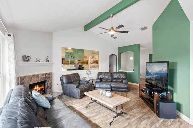 1126 Heathfield Dr, Channelview, TX 77530 - living room featuring wood finished floors, ceiling fan, and a fireplace