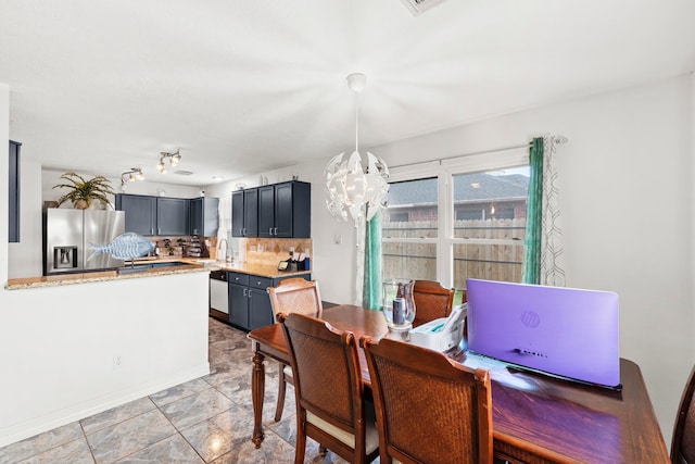 1126 Heathfield Dr, Channelview, TX 77530 - dining area featuring a chandelier