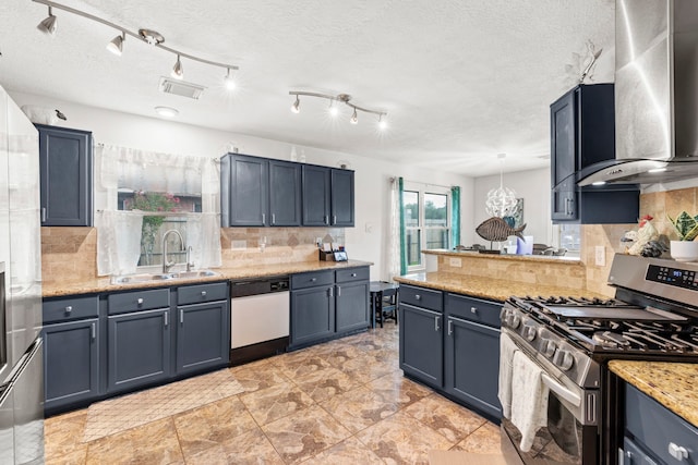 1126 Heathfield Dr, Channelview, TX 77530 - kitchen featuring stainless steel range with gas cooktop, white dishwasher, wall chimney range hood, decorative backsplash, and blue cabinets