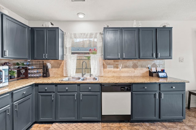1126 Heathfield Dr, Channelview, TX 77530 - kitchen with dishwasher, backsplash, a textured ceiling, light stone counters, and stainless steel microwave