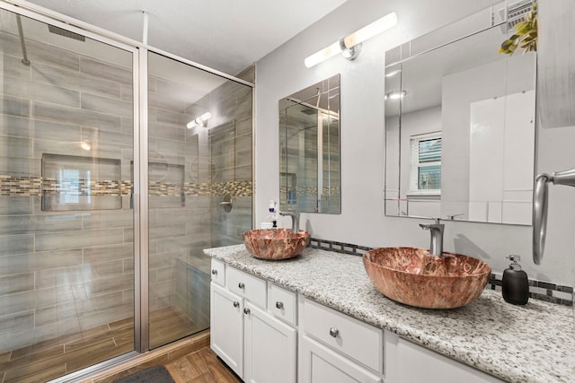 1126 Heathfield Dr, Channelview, TX 77530 - full bathroom with a shower stall, vanity, and wood finished floors