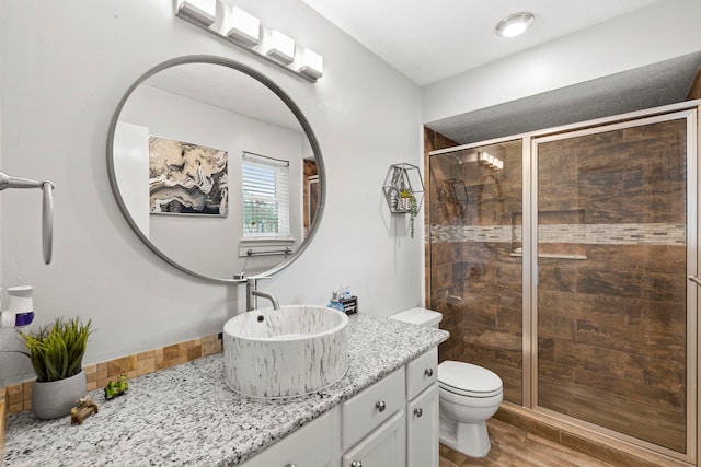 1126 Heathfield Dr, Channelview, TX 77530 - full bath with vanity, a stall shower, and wood finished floors