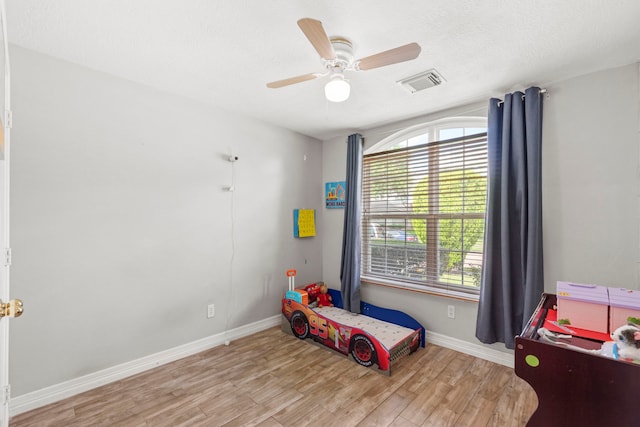 1126 Heathfield Dr, Channelview, TX 77530 - bedroom featuring wood finished floors and a ceiling fan
