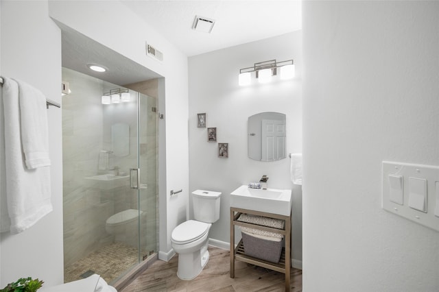 21215 Kelliwood Greens Dr, Katy, TX 77450 - bathroom with a stall shower, vanity, and wood finished floors